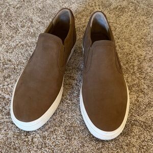 Vince leather Fletcher style perforated slip on shoes with white sole.